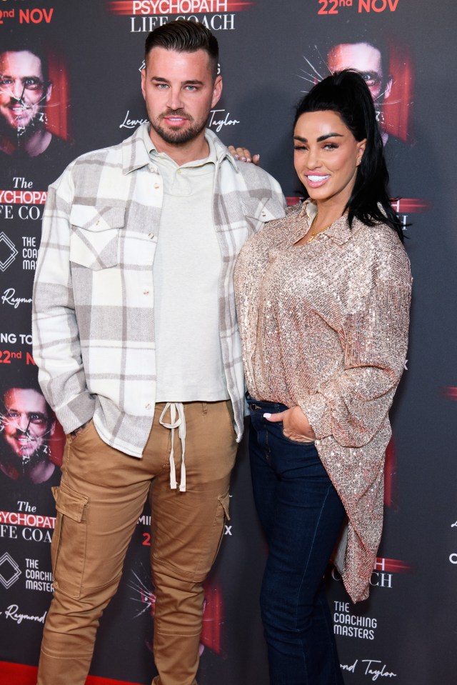 a man and a woman standing on a red carpet that says psychopath life coach