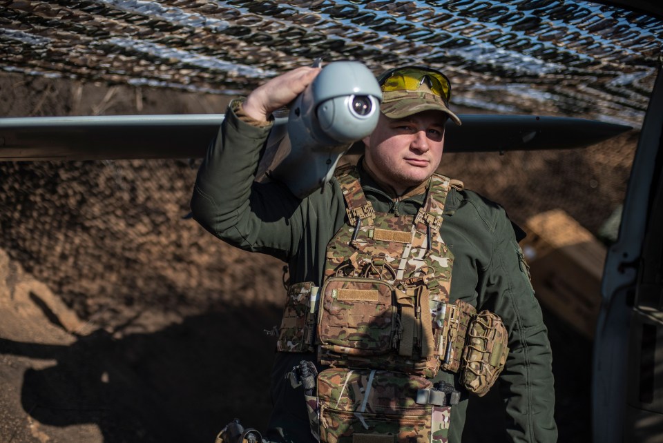 A drone held by a member of the reconnaissance unit