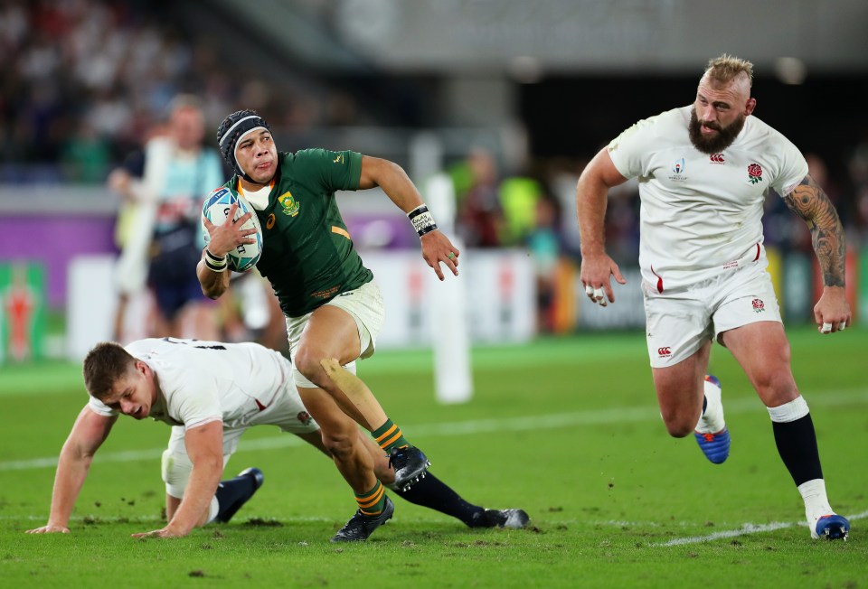 a rugby player wearing a jersey that says ' south africa ' on it