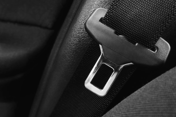 a close up of a seat belt in a car