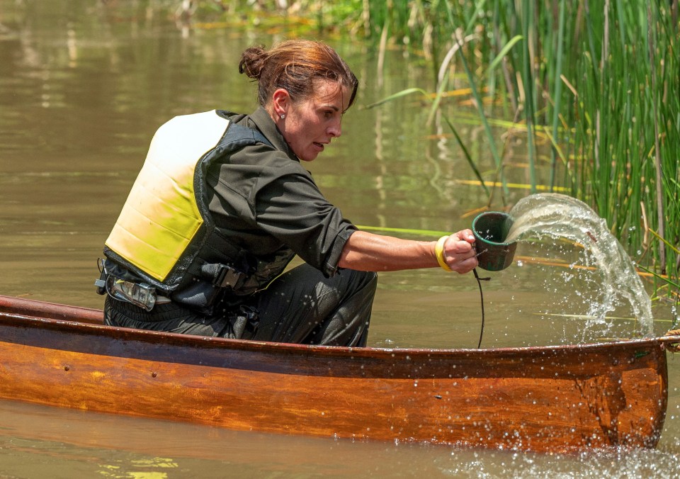 a woman in a boat pouring water from a cup