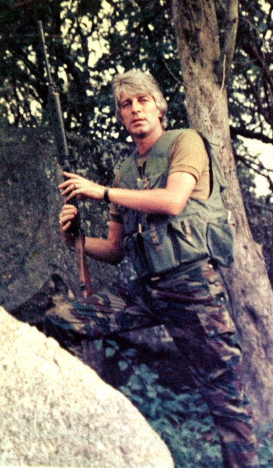 Dave pictured with a gun in Columbia in 1988