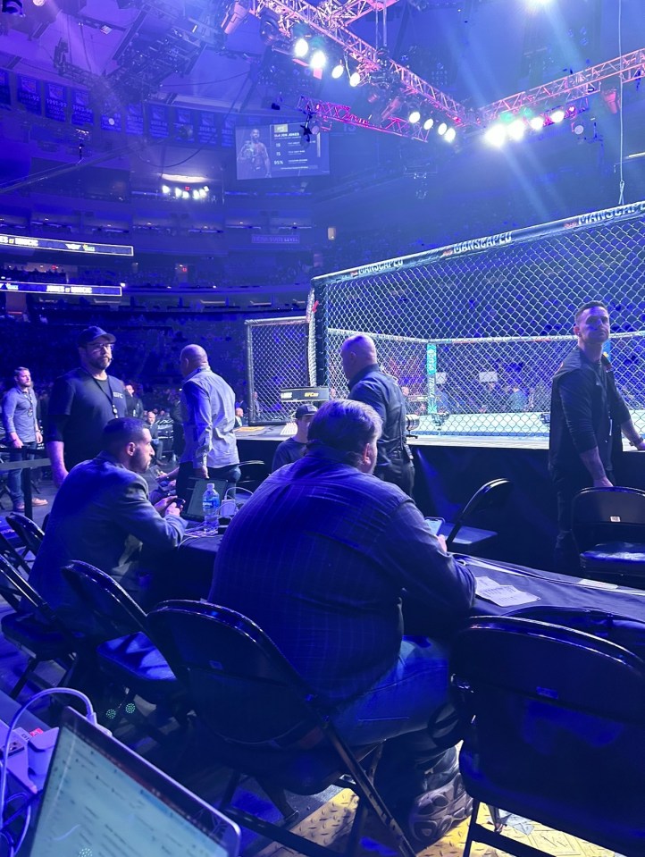 Joe Rogan returns to his seat after being hounded by fans as he went to the bathroom