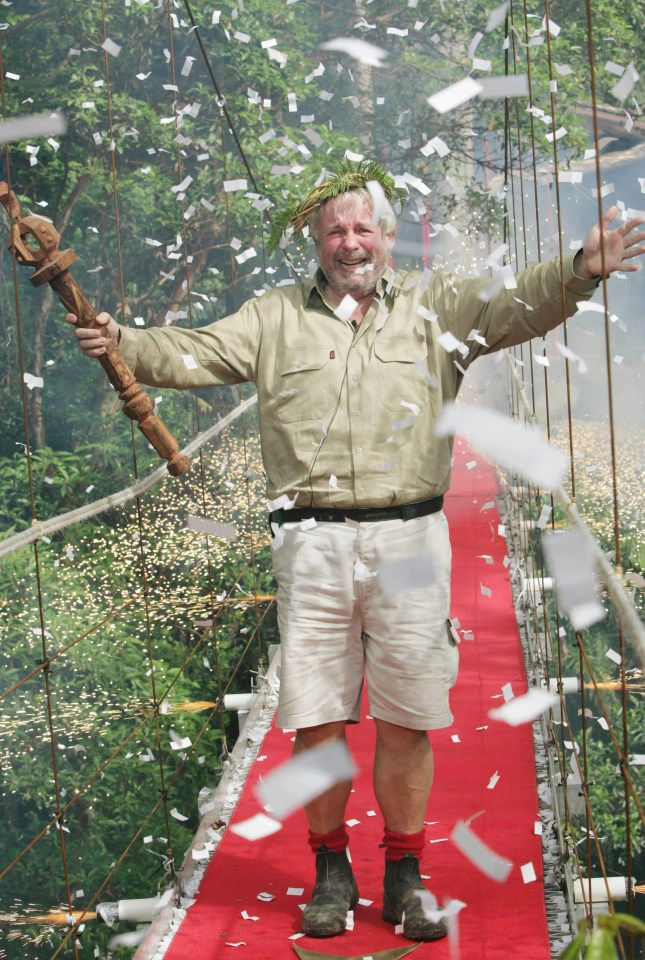 a man on a red carpet with confetti falling around him