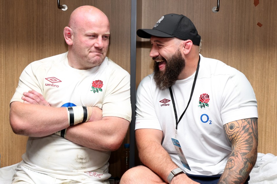 two men wearing umbro shirts sit next to each other