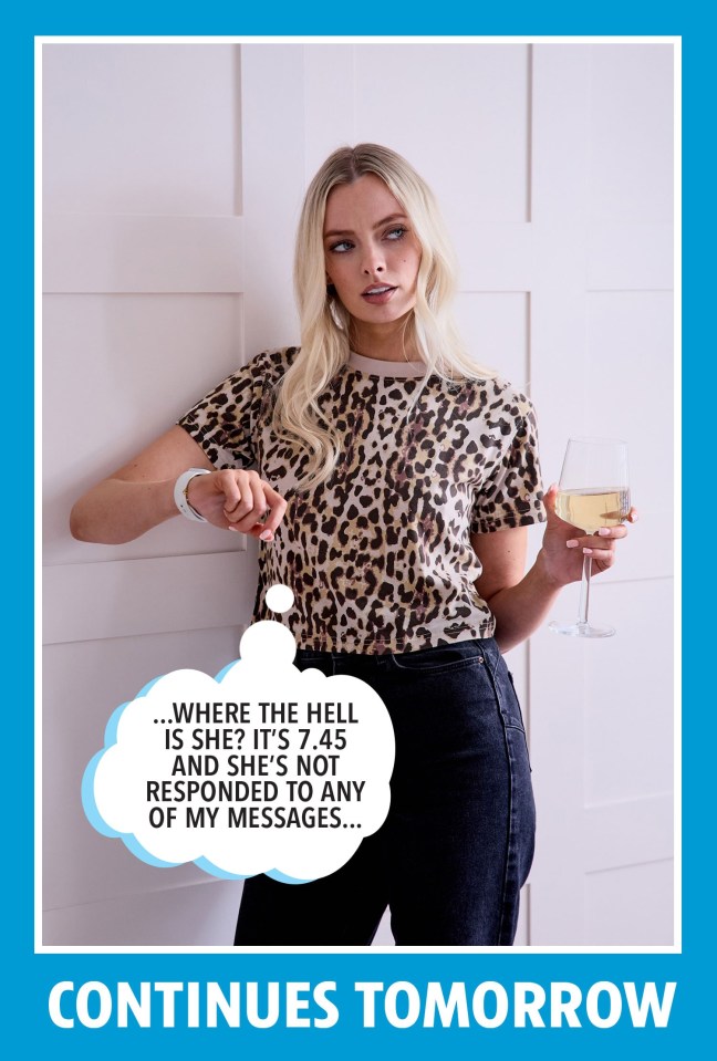 a woman in a leopard print shirt is holding a glass of wine