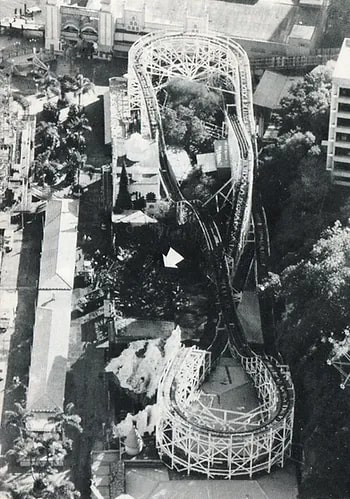 an aerial view of a roller coaster at an amusement park .