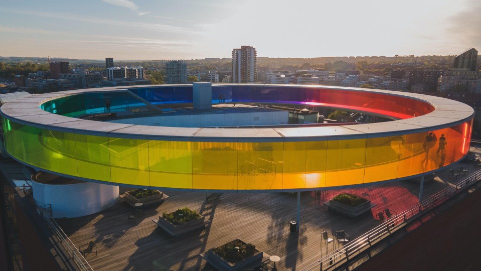 an aerial view of a rainbow colored building