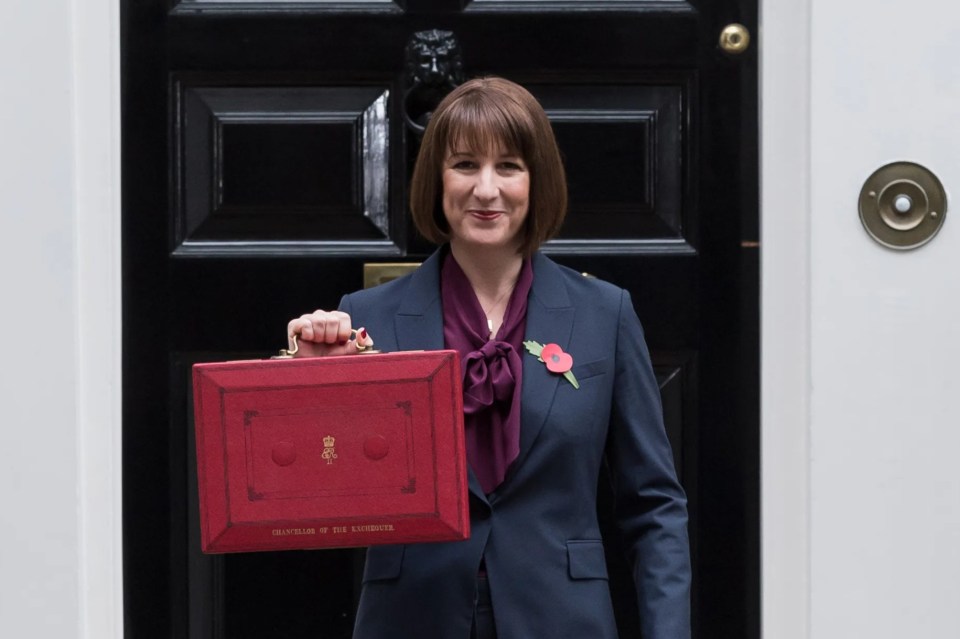 a woman holding a red briefcase with the number 11 on it