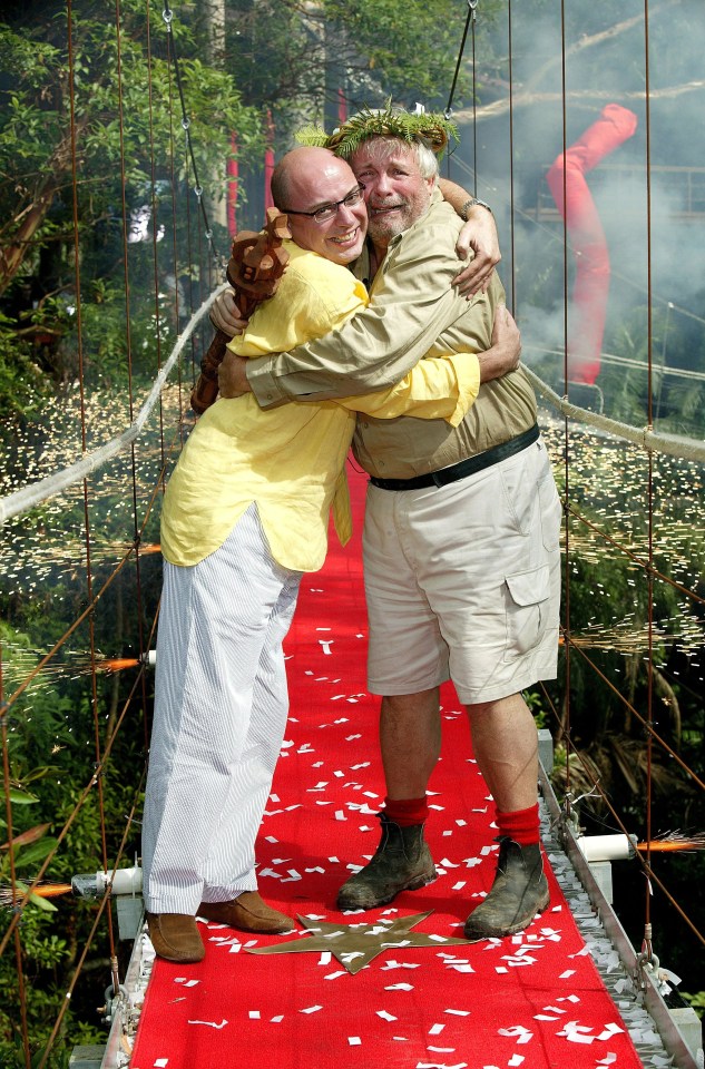 two men hugging on a red carpet with a watermark that says ' reuters ' on it