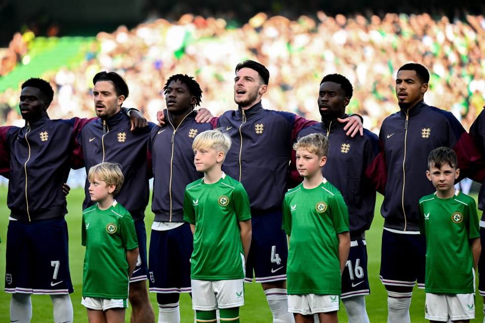 a group of soccer players wearing nike jerseys stand together