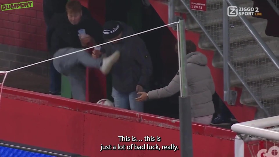 An FC Twente fan booted his pal's pint by mistake