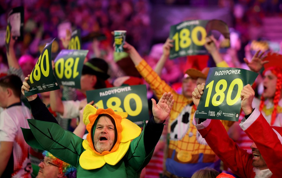 Fans in fancy dress go wild at World Darts Championship at Alexandra Palace, London