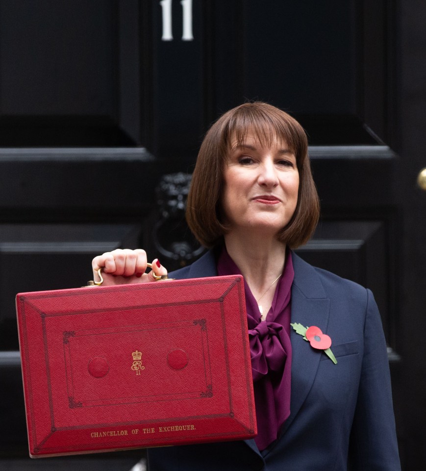 a woman holding a red briefcase that says ' chancellor of the exchequer ' on it