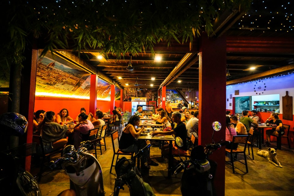 Tourists drinking at a club at the Nana hostel in Vang Vieng, Laos