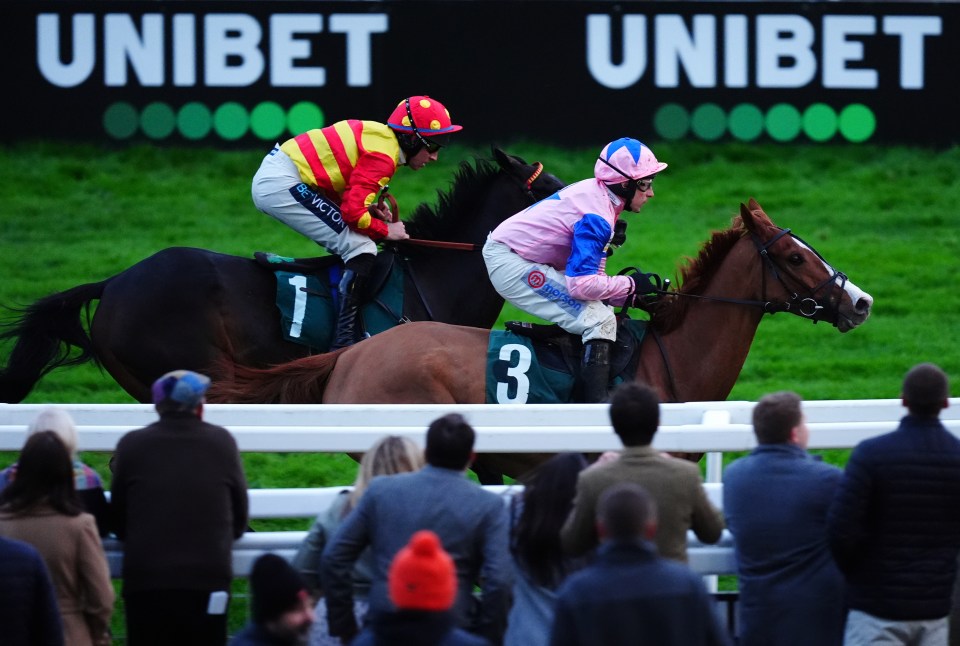 jockeys on horses in front of a sign that says unibet