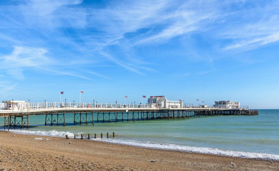 a pier with a building that says ' the pier ' on it