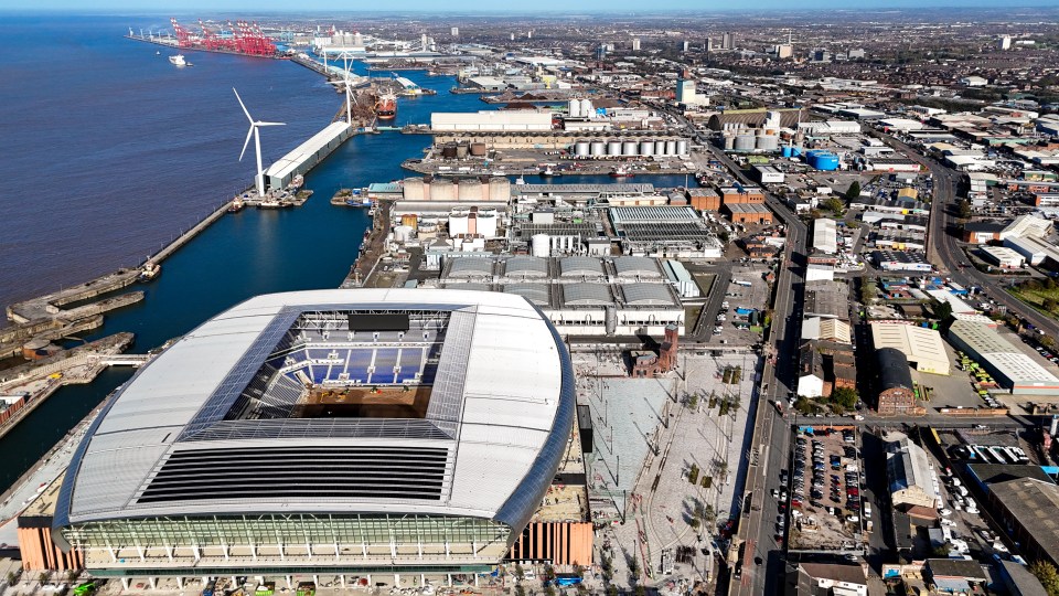 an aerial view of a large stadium in the middle of a city