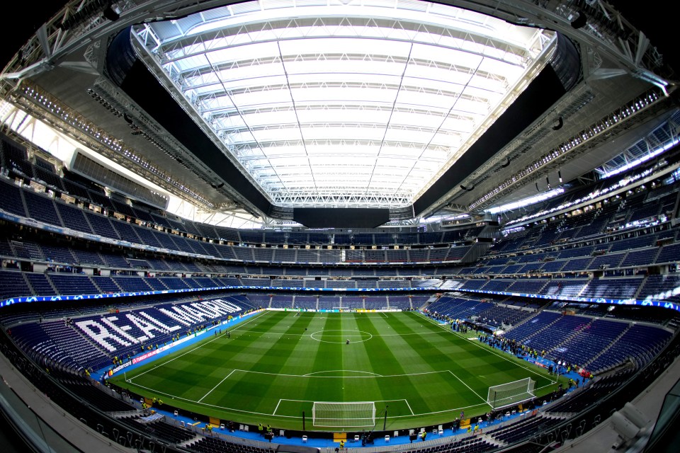 a soccer field with the word real madrid on the field