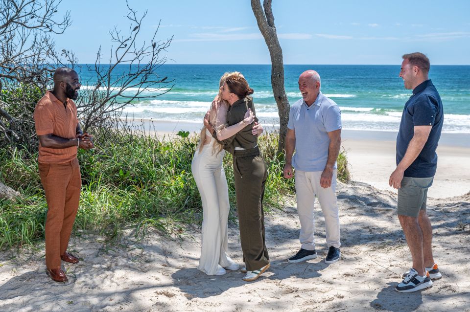 Coleen Rooney and GK Barry hugged each other on the beach as part of the first meeting on I'm A Celebrity