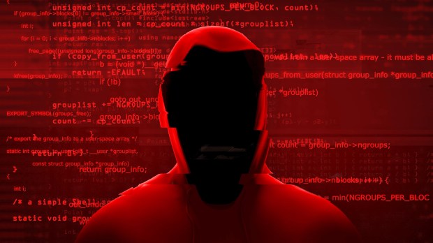 a man in a red hoodie is surrounded by red code