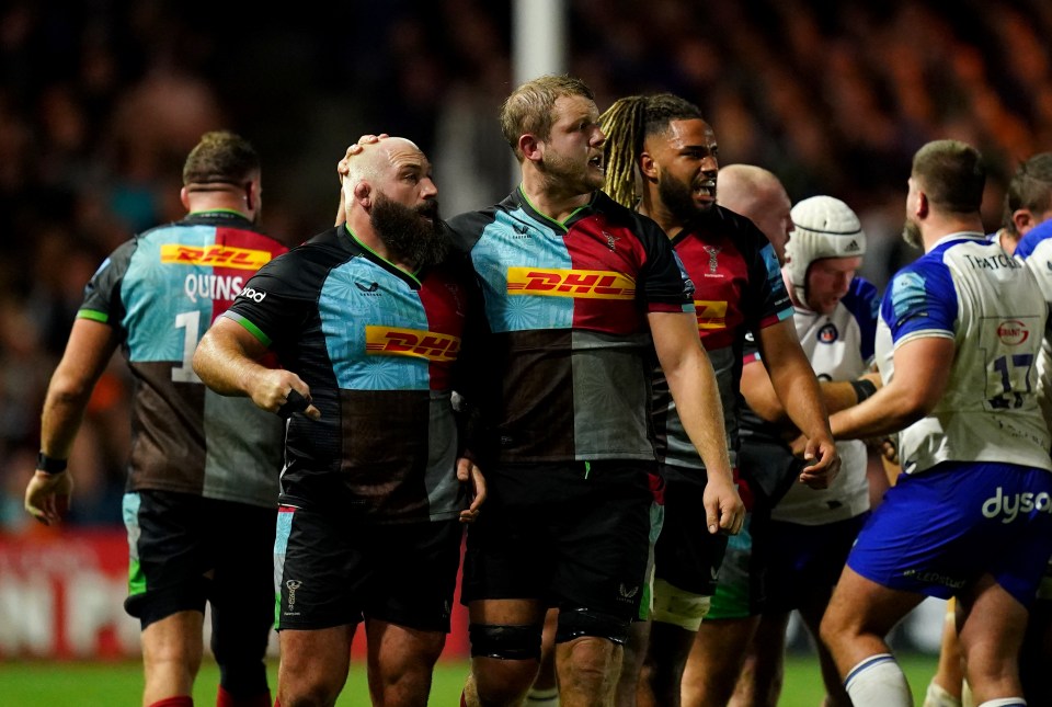 a group of rugby players wearing dhl jerseys