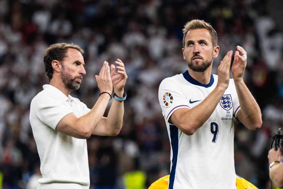 a man wearing a number 9 jersey applauds