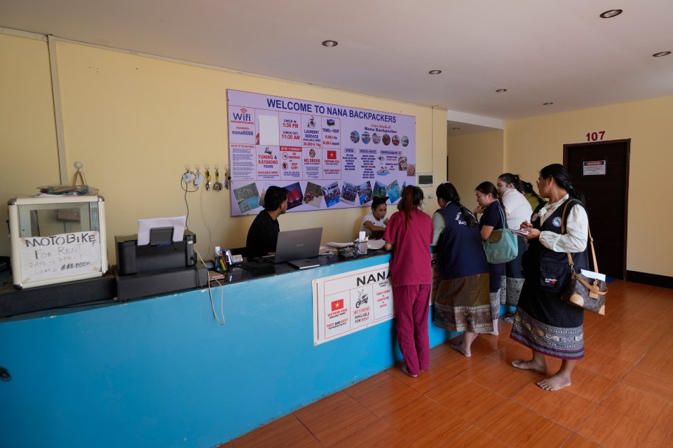 Officials check documents and speak to the hostel employees