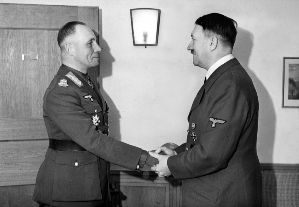 Adolph Hitler and Colonel-General Erwin Rommel  during his honour with the Knights Cross of the Iron Cross in 1941