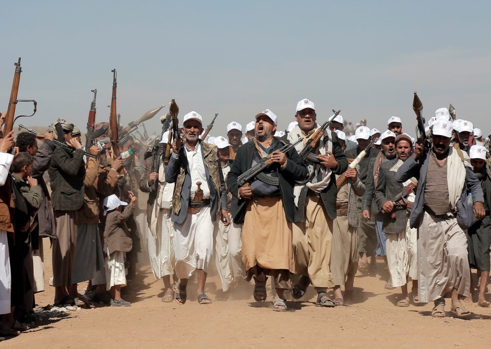 Houthi fighters march during a rally of support for the Palestinians in the Gaza Strip