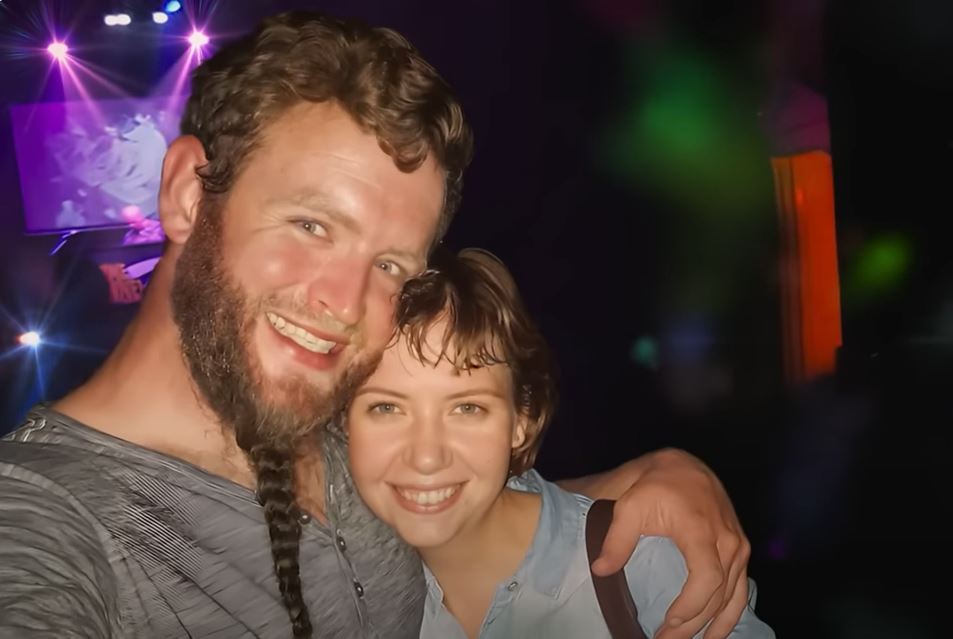 a man and a woman are posing for a picture in front of a stage that says york