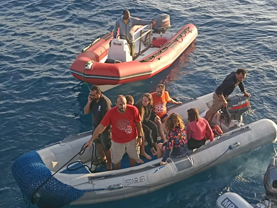 Survivors of the sinking being brought ashore