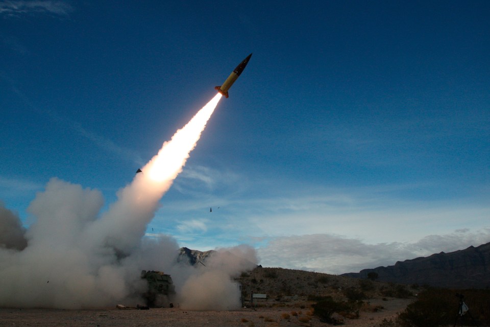 a rocket is being launched into the sky with smoke coming out of it