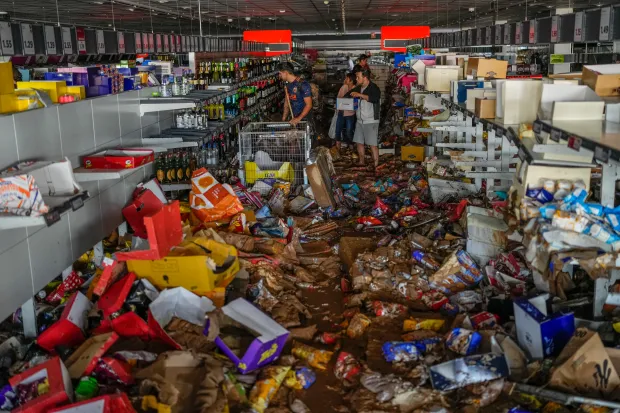 a flooded store with a red sign that says 1.30