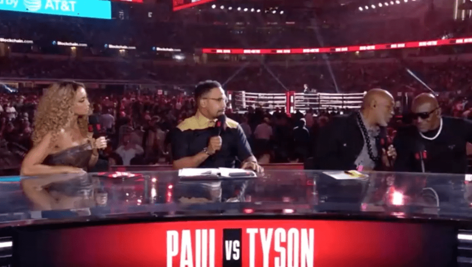 a group of people sitting at a table with the words paul vs tyson on it