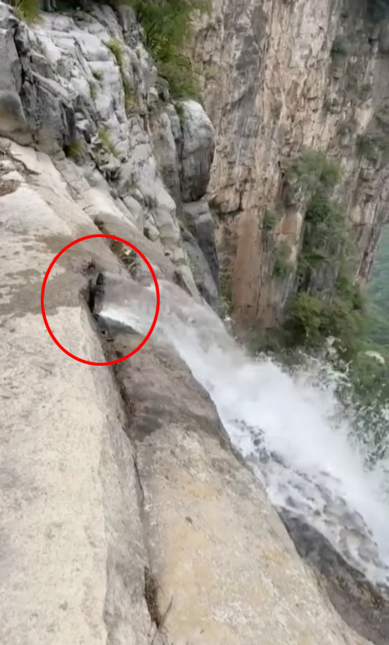 a waterfall is shown with a red circle around it