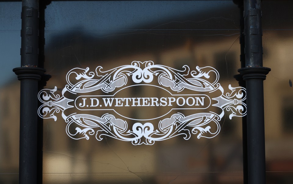 a sign that says j.d.wetherspoon on it