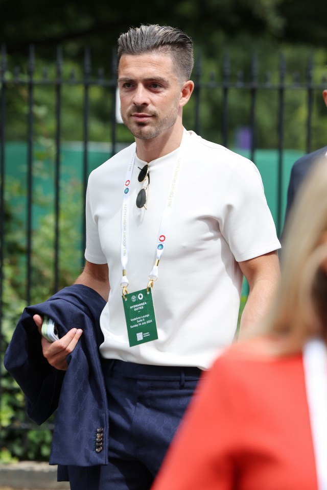 a man with a lanyard around his neck that says wimbledon