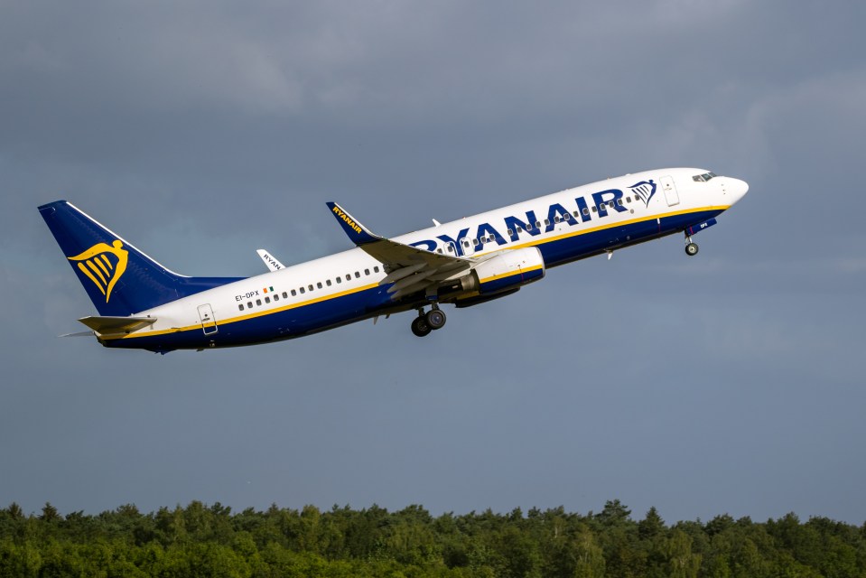 a ryanair plane is taking off from a runway