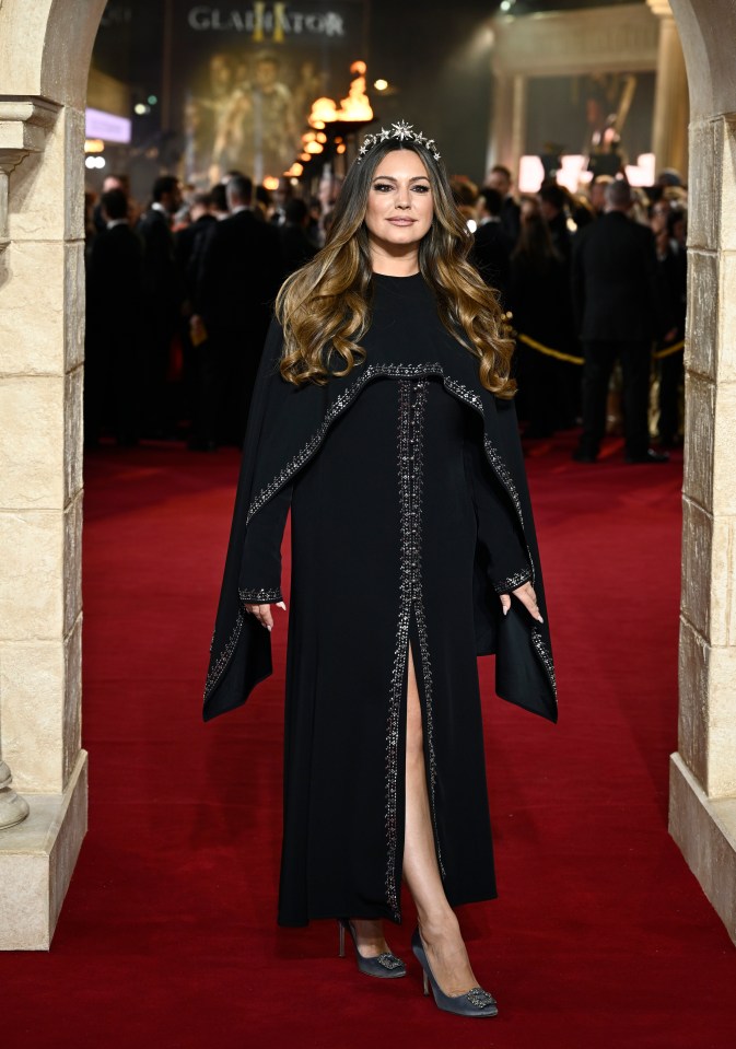 Kelly Brook opted for a statement black dress, shawl and tiara