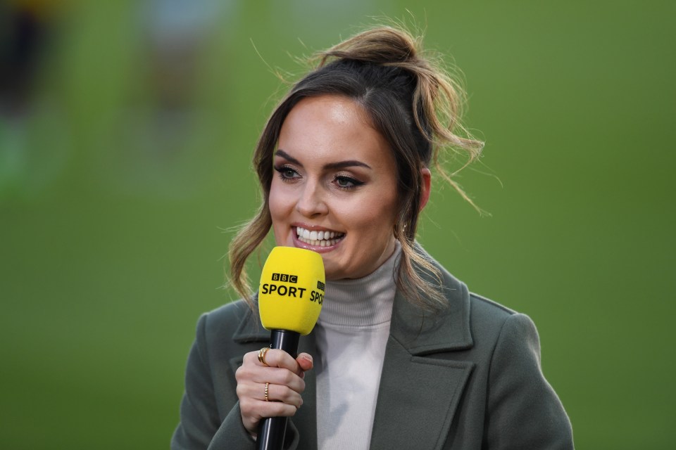 a woman holding a microphone that says bbc sport on it