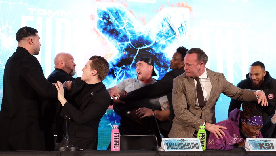 a group of men standing around a table with a sign that says prime