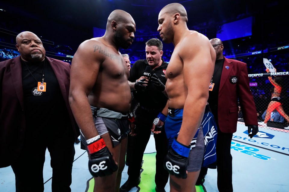 a man with the number 30 on his shorts stands next to another man