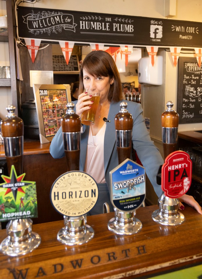 a woman drinking from a tap that says horizon