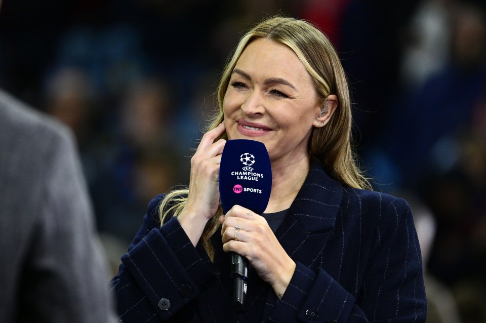 a woman holding a microphone that says champions league on it