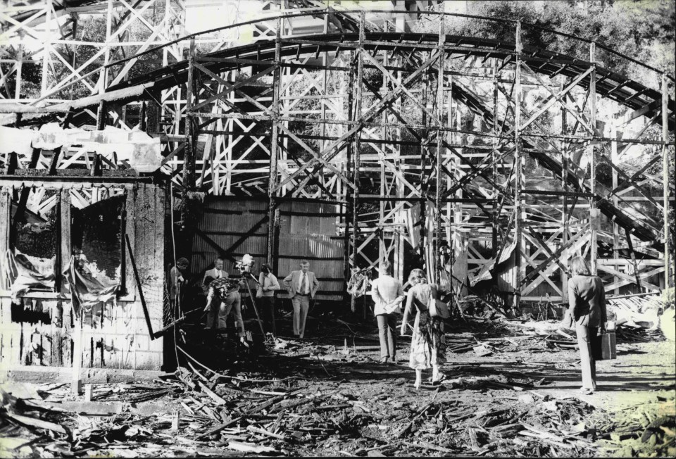 a black and white photo of a roller coaster under construction