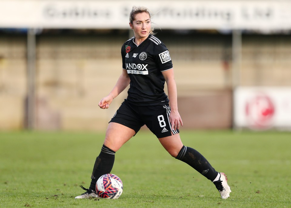 a female soccer player with the number 8 on her jersey