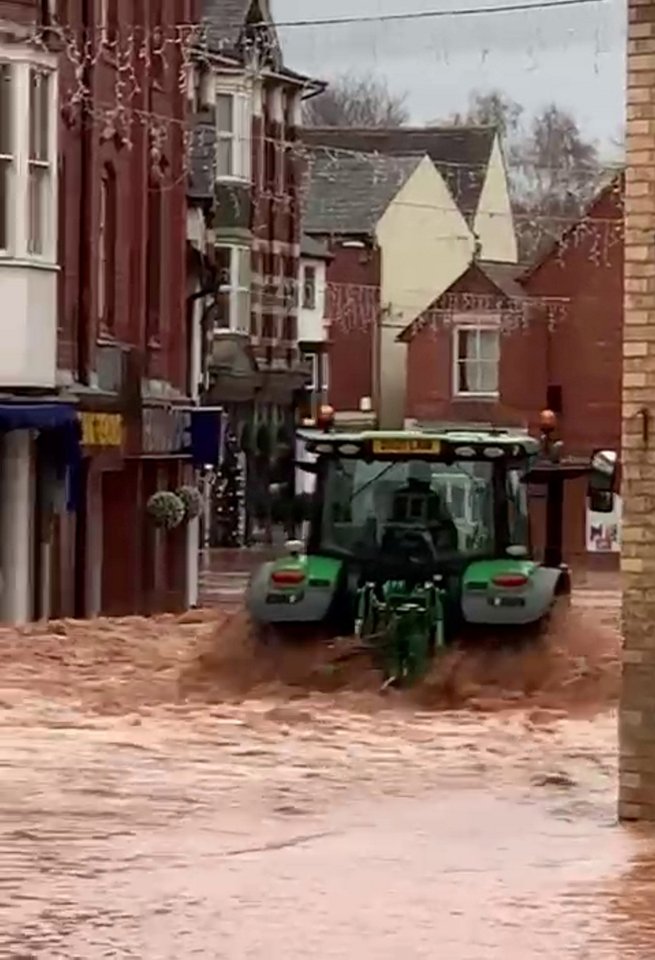 A man in a tractor battled the flooding as he drove down Tenbury Wells High Street