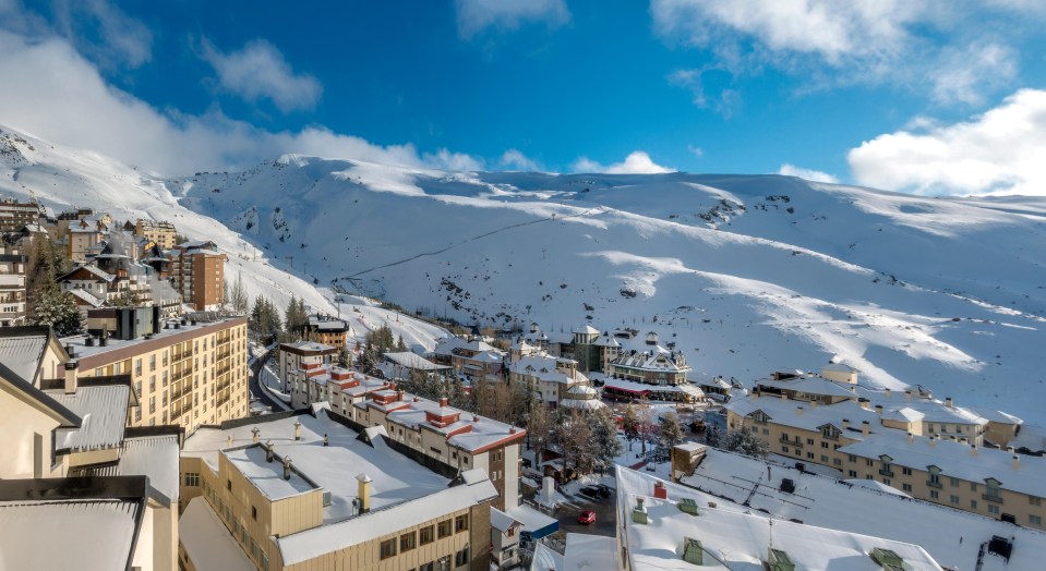 an aerial view of a snowy mountain town