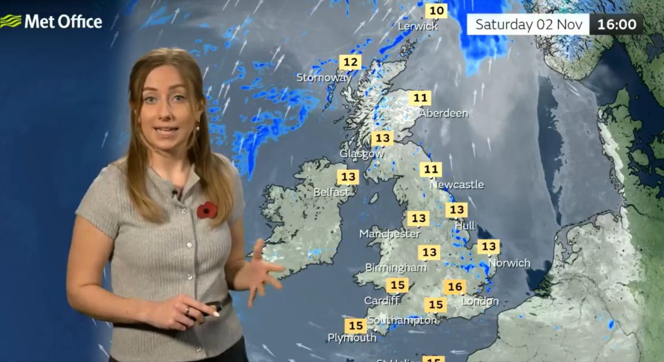 a woman stands in front of a met office weather map